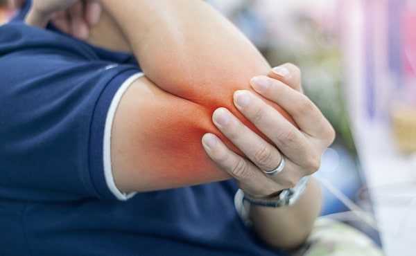 businessman suffering elbow pain office