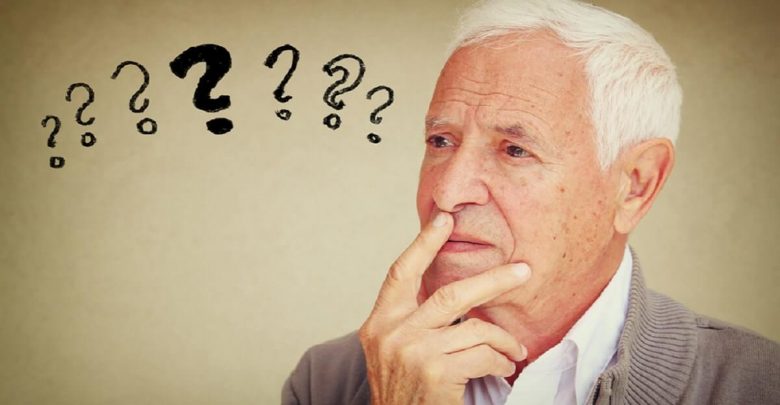 image of senior man thinking with set of question marks icons