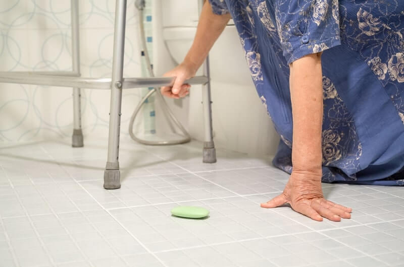elderly woman falling in bathroom because slippery surfaces