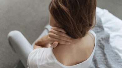 young woman suffering from neck pain
